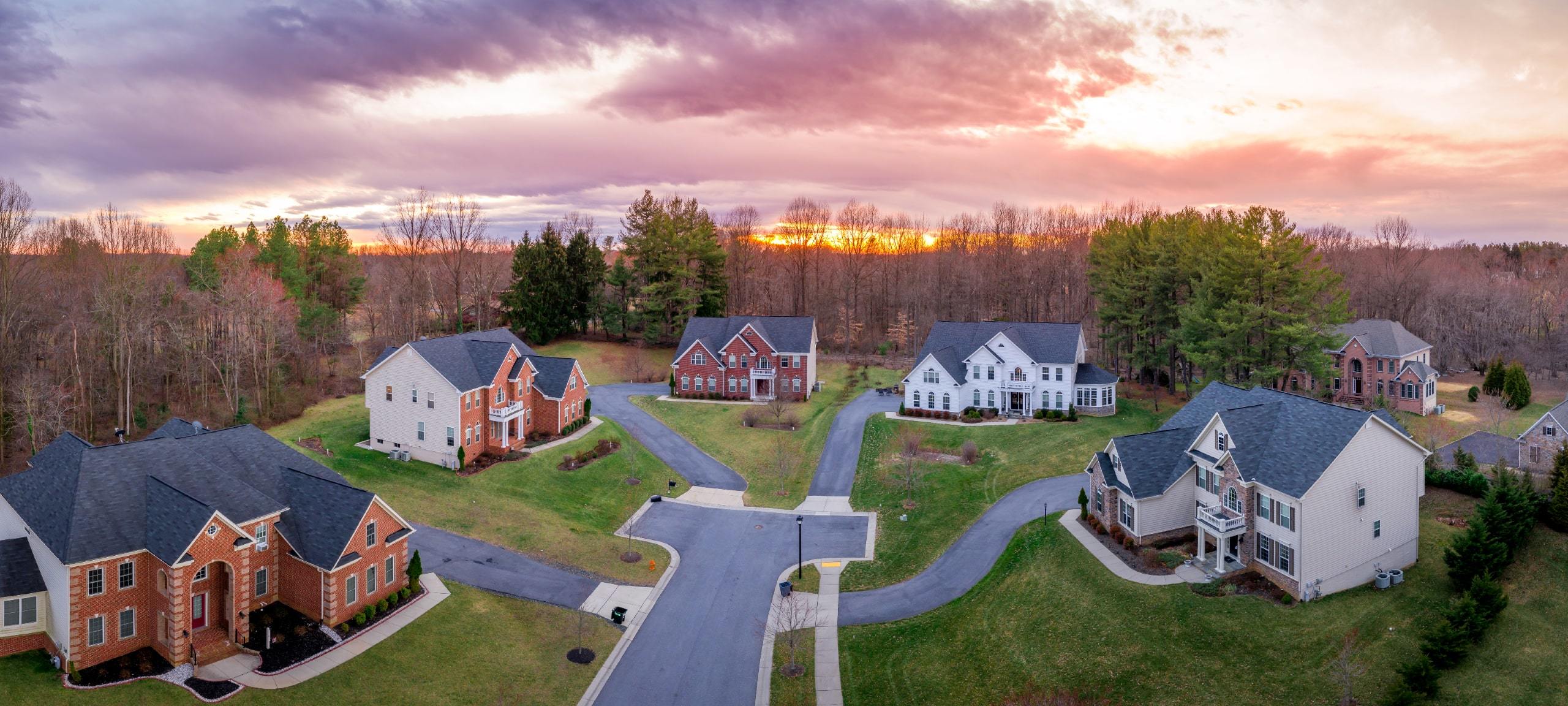 Luxury homes in neighborhood in Clarksville, MD during sunset