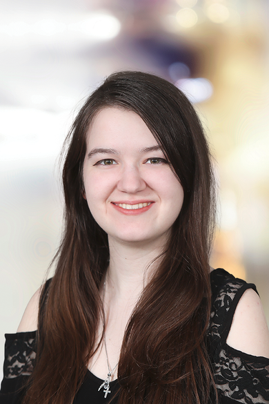 Portrait of Jess Mosholder, Creative Team Coordinator/Lead Brokerage Designer.