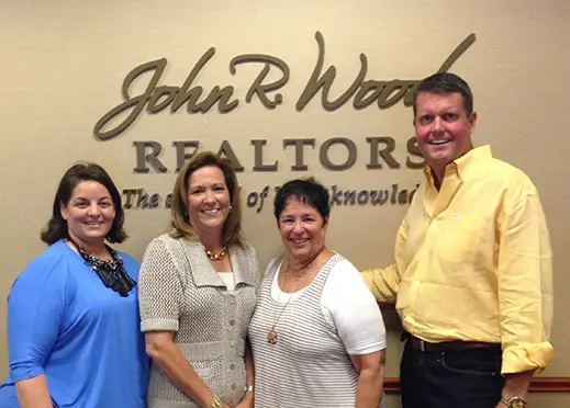 Creig and Carla Northrop with members of the John R. Wood Team