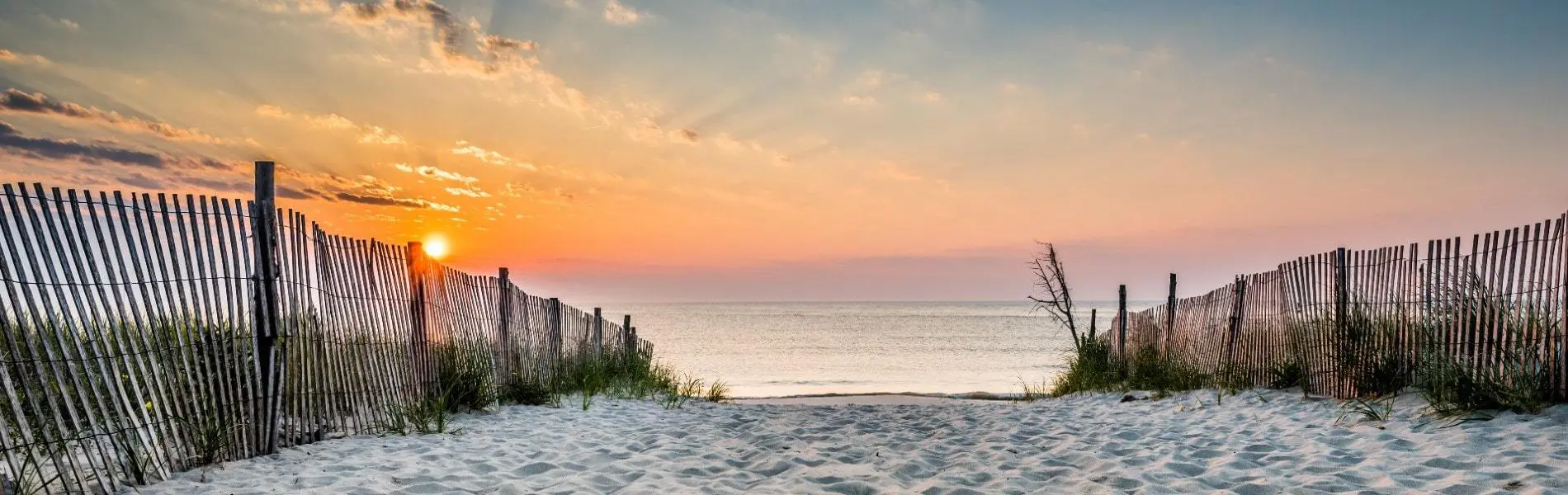 Sandy path to beach in Bethany Beach, Delaware at sunrise