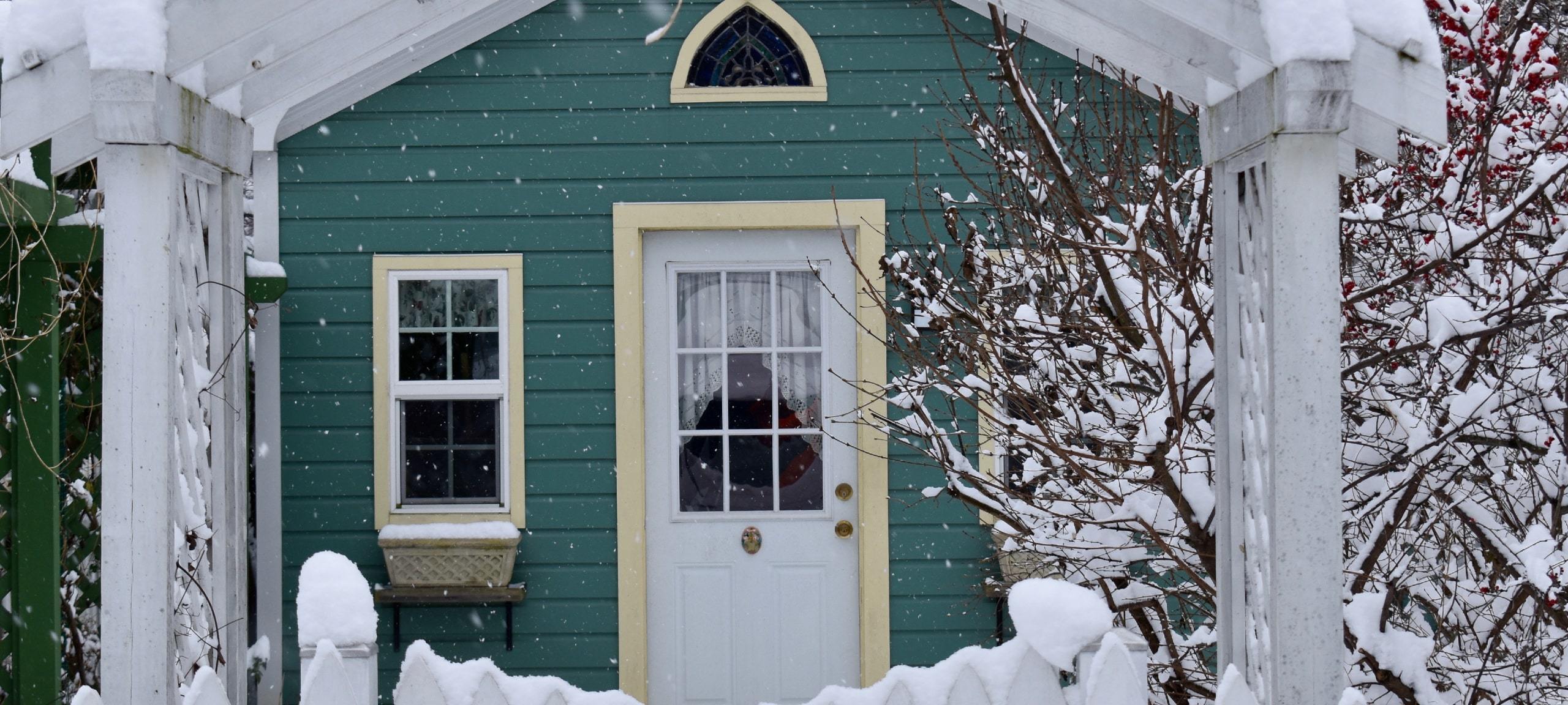 Green cottage in Hyattsville, Maryland after snowstorm